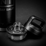 Black water bottle with clear cap on a dark background